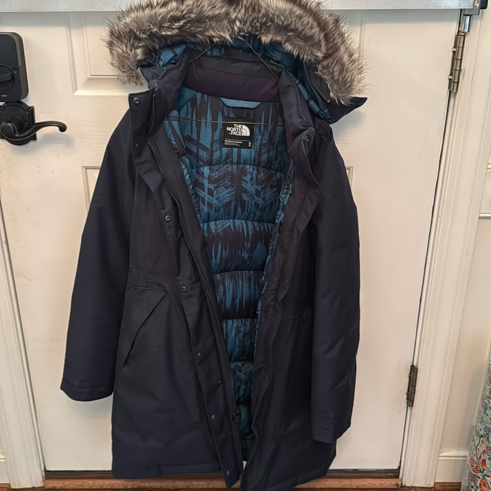 North Face navy knee length down winter coat with fur detachable hood. Like new!